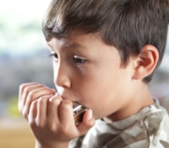 Boy playing harmonica 3